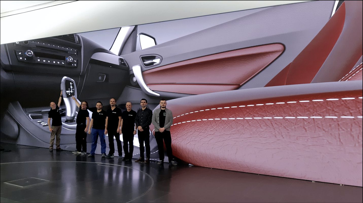 TRUE Performance engineers in front of a dvLED wall-sized dvLED display rendering a BMW interior at true color accuracy in an automotive design studio