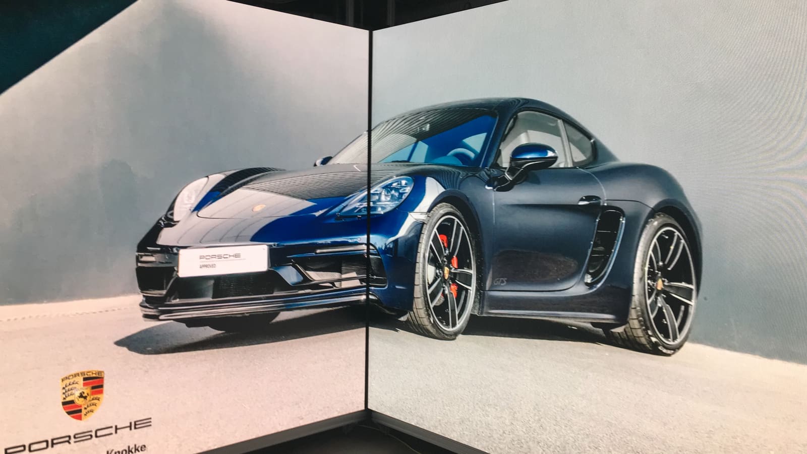 Porsche shown across a corner of two TRUE dvLED walls in a design studio