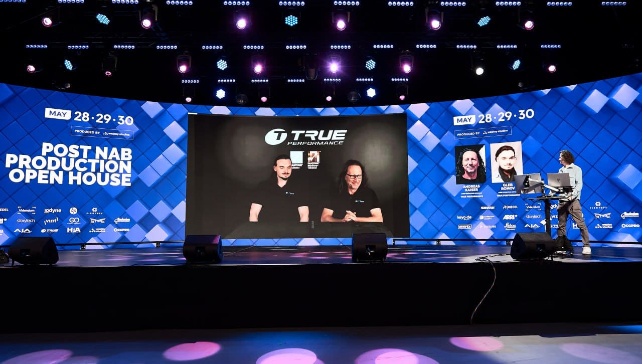 TRUE Performance interview playing on a large curved dvLED event dvLED wall