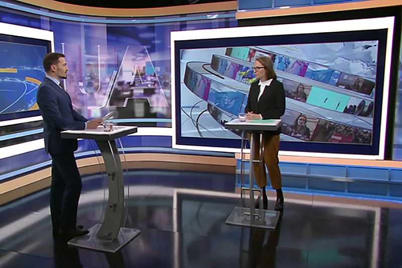 News anchors in front of a TRUE dvLED studio dvLED wall