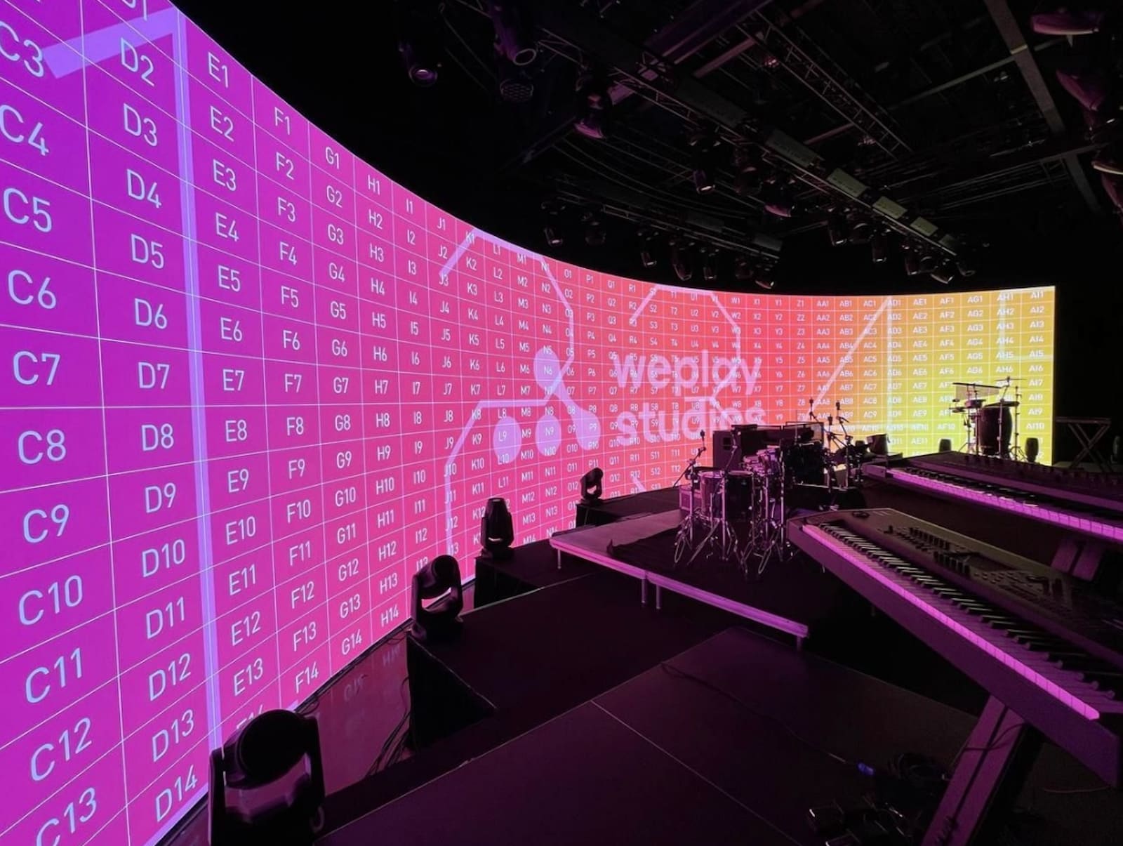 Large curved TRUE dvLED studio dvLED wall running a panel mapping grid during commissioning