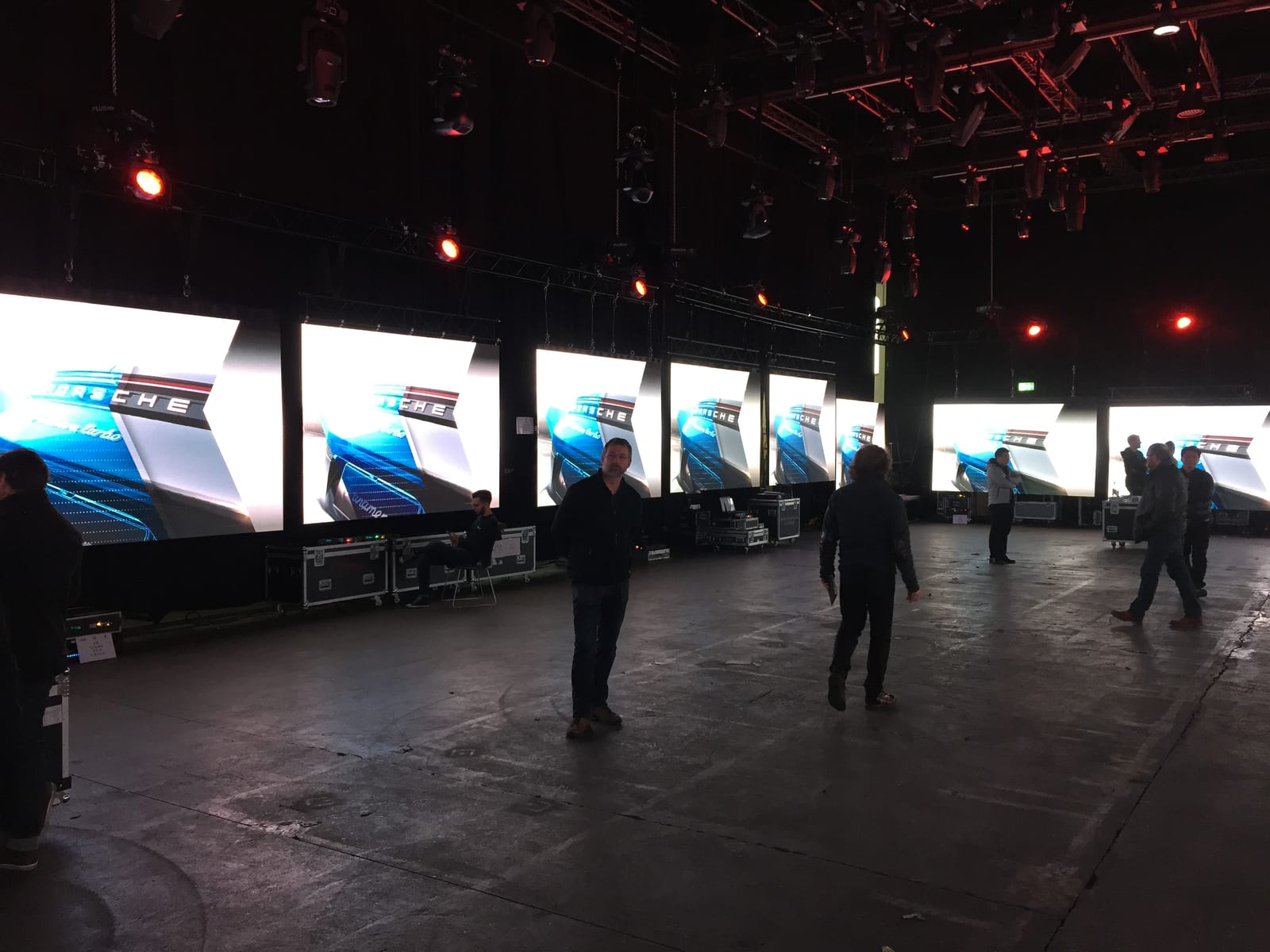 Eight dvLED walls side by side in a hall, all showing the same Porsche image during a manufacturer shootout won by TRUE