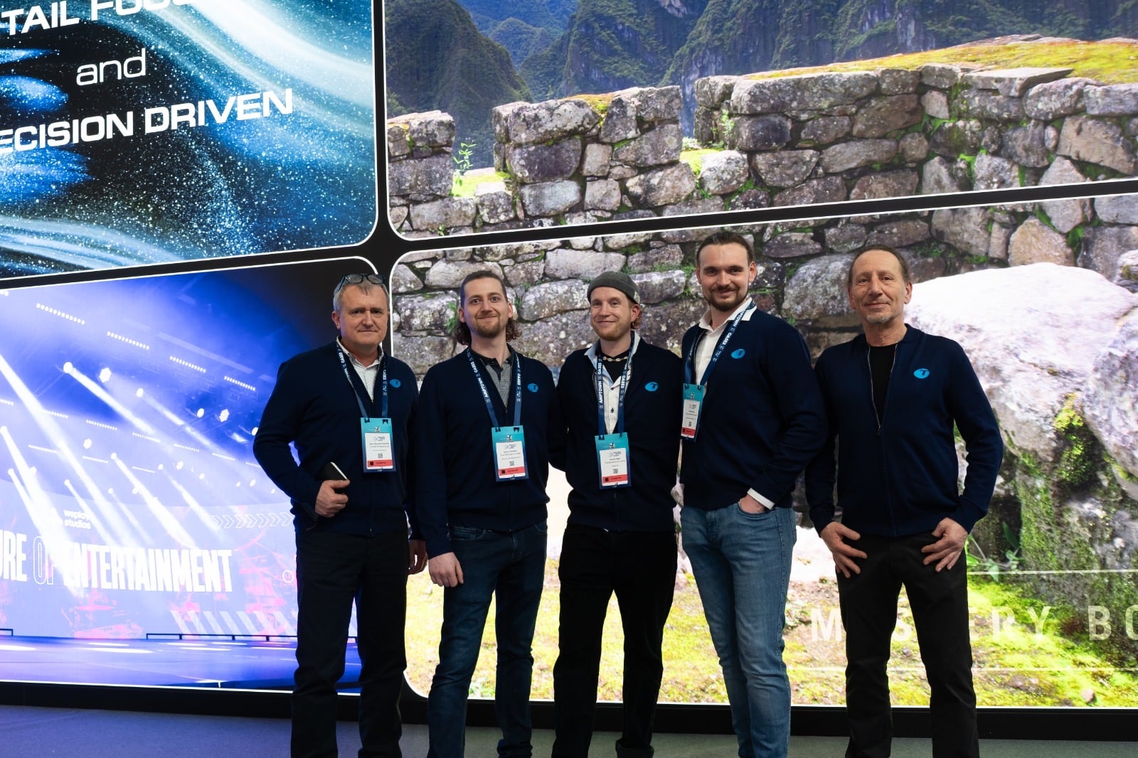 The TRUE Performance team in front of a fine pitch TRUE dvLED wall on the TRUE stand at a trade show